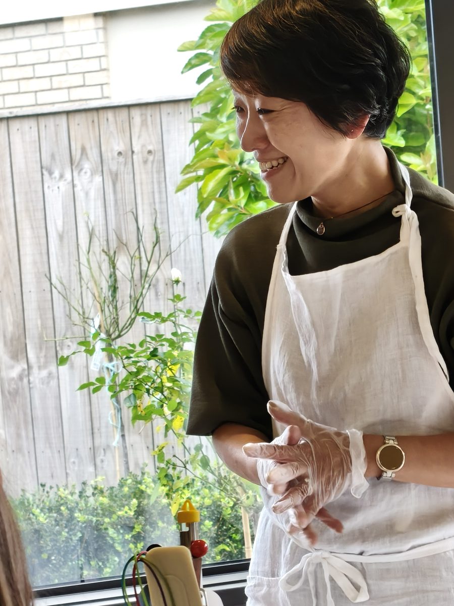 Shinobu smiling as she teaches a soap making class